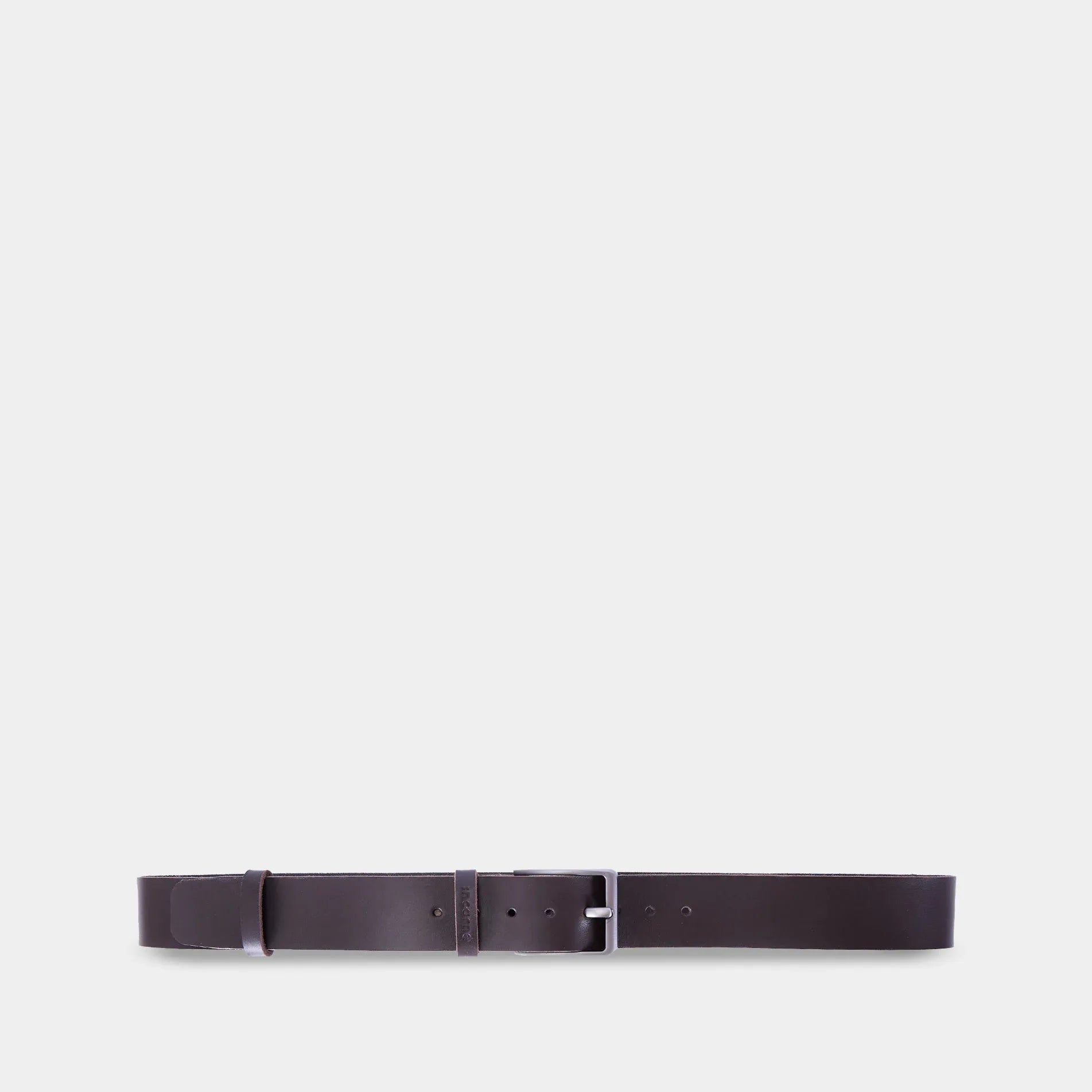 INCARNE New Parallel brown leather belt with silver buckle laid flat to show minimalist unisex design