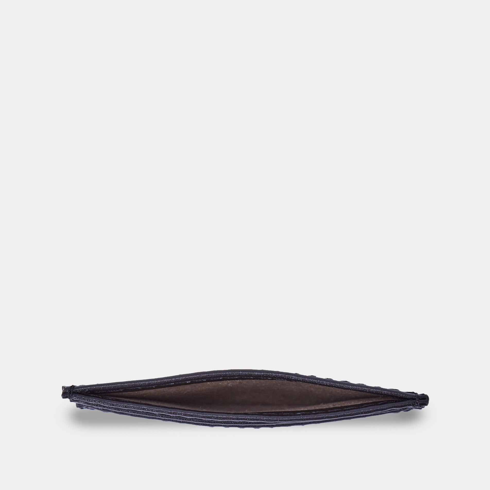 Minimal black leather cardholder with cards inside