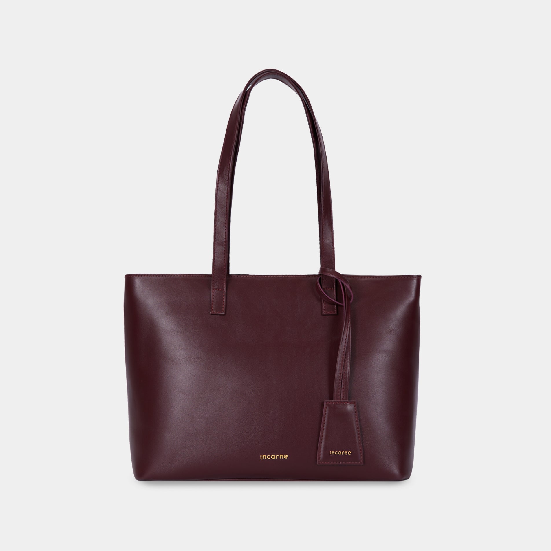Deep burgundy leather of Emeli bag and Minimal cardholder close-up